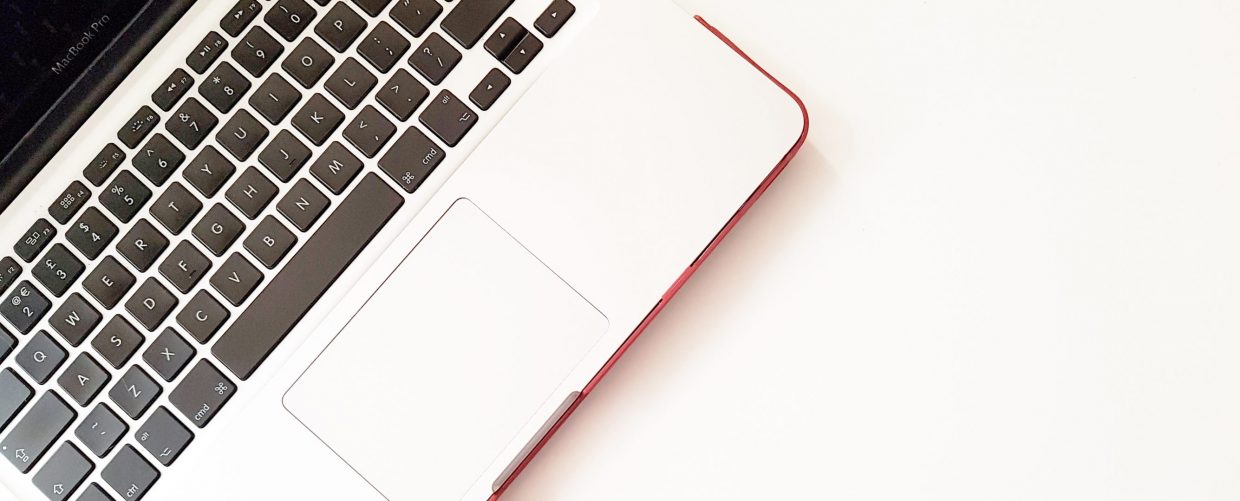 Macbook on a white worktop